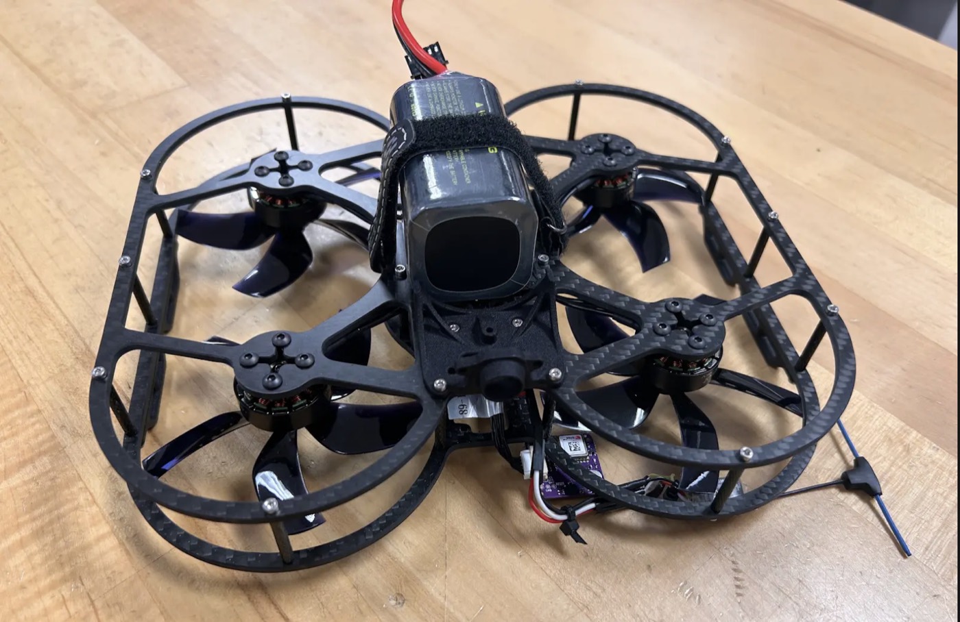 Assembled ModalAI drone on a workbench